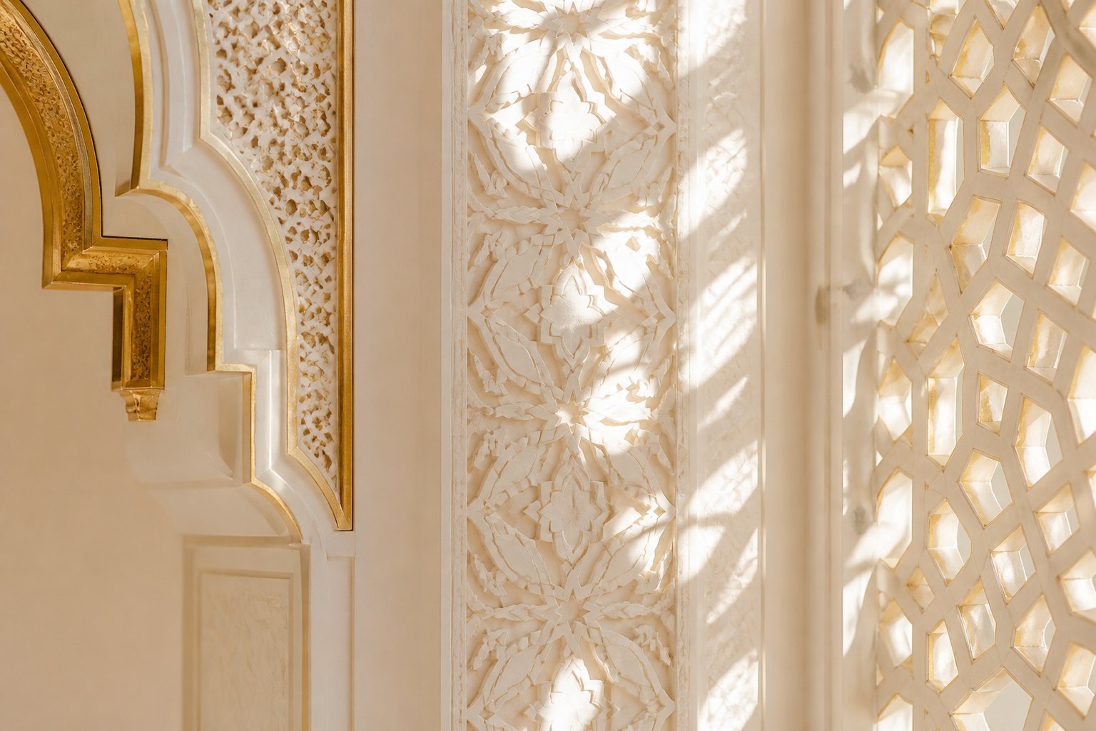Sunlit carved plaster and champagne gold leaf.